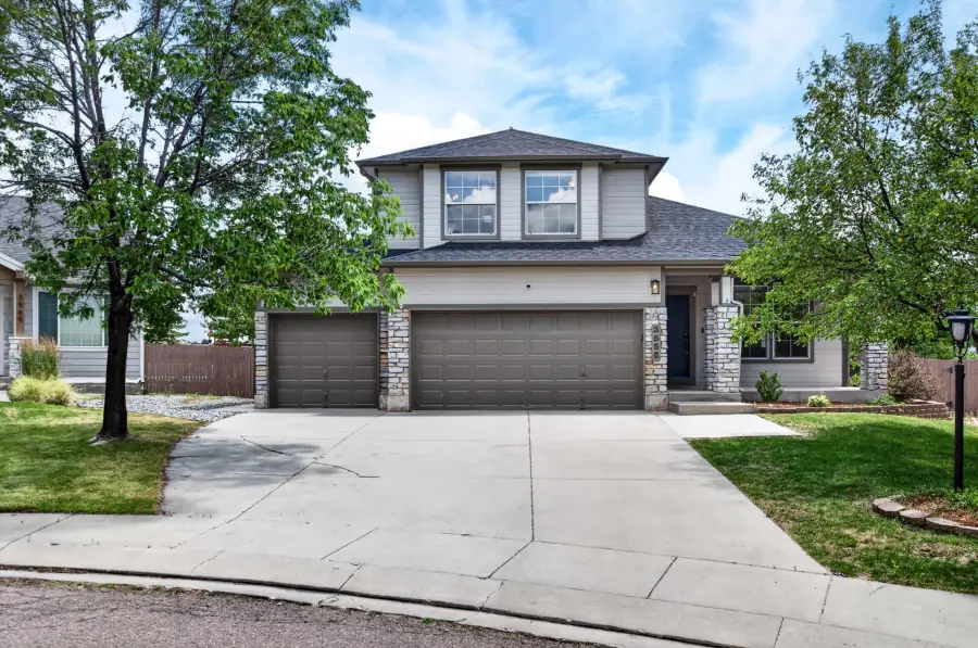 Daytime front exterior of the two-story home at 3555 Painted Daisy Ct, Colorado Springs